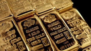 Giá vàng thế giới giảm mạnh do tâm lý lạc quan thương mại toàn cầu