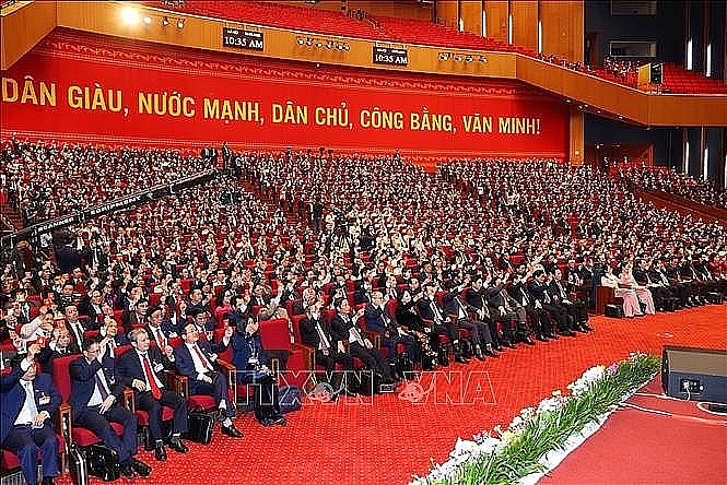 Các đại biểu biểu quyết thông qua Quy chế làm việc của Đại hội, ngày 25/1. Ảnh: TTXVN Các đại biểu biểu quyết thông qua Quy chế làm việc của Đại hội, ngày 25/1. Ảnh: TTXVN